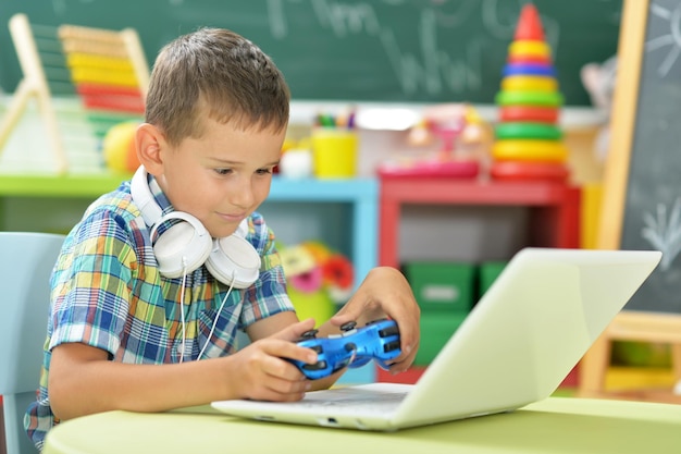 Little boy using laptop