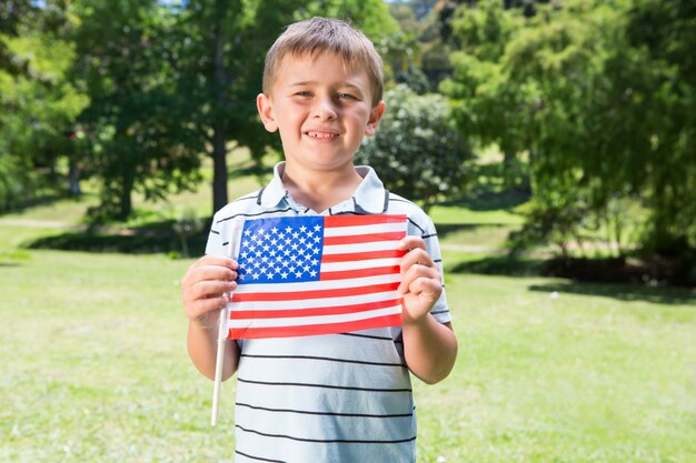 Little boy waving american flag