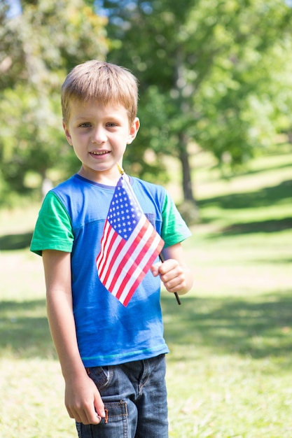 Little boy waving american flag