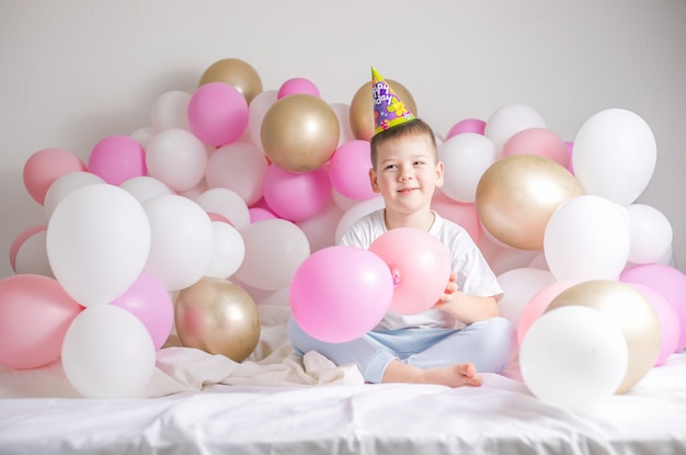 Little boy in white balloons