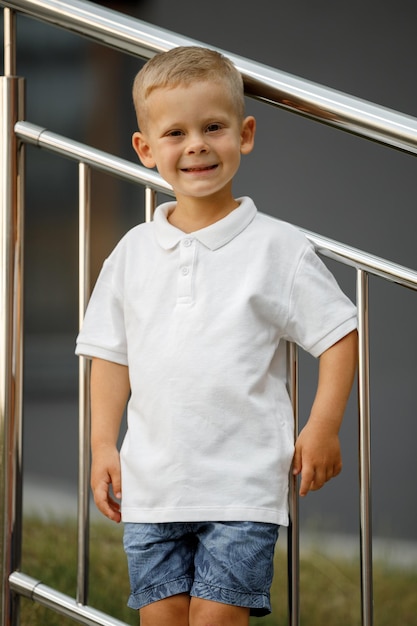 Little boy in white tshirt space for your logo or design Mockup for print