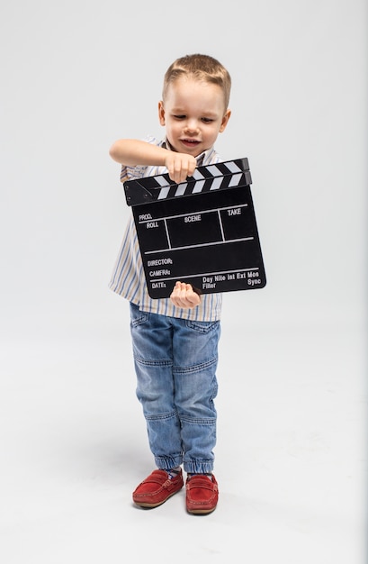 little boy with clapper board at studio 