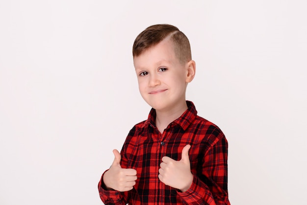 The little boy with expressive emotion on a white background