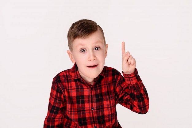 The little boy with expressive emotion on a white background. 