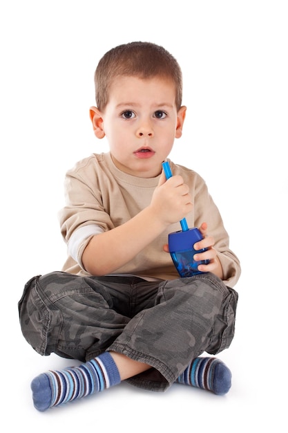 Little boy with pencil sharpener