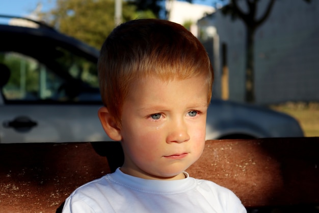 A little boy with tears in his eyes