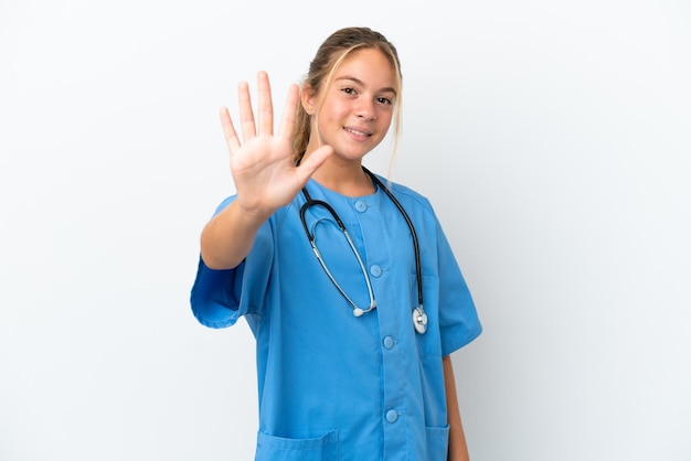 Little caucasian girl disguised as surgeon isolated on white background counting five with fingers