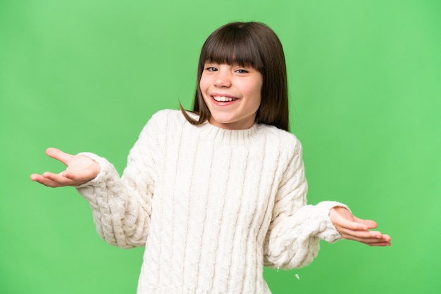 Little caucasian girl over isolated background happy and smiling