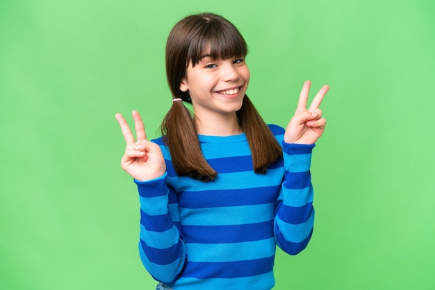 Little caucasian girl over isolated background showing victory sign with both hands