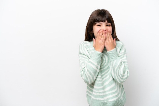 Little caucasian girl isolated on white background happy and smiling covering mouth with hands