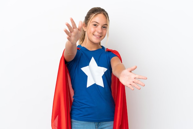 Little caucasian girl isolated on white background in superhero costume and doing coming gesture