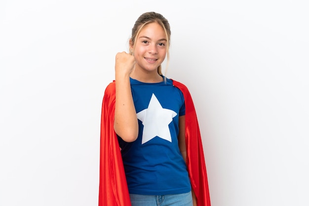 Little caucasian girl isolated on white background in superhero costume