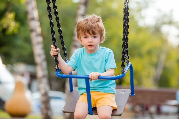 Little cheerful boy in the playground