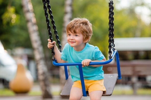 Little cheerful boy in the playground