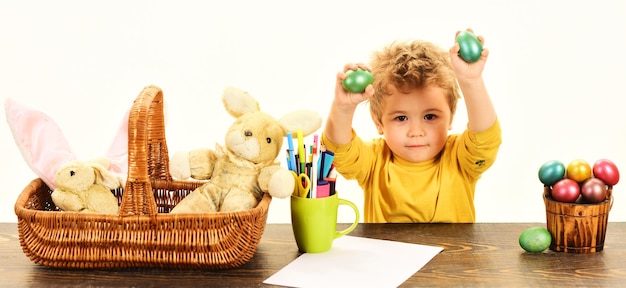 Little child boy with easter egg happy family holidays hunting eggs spring time