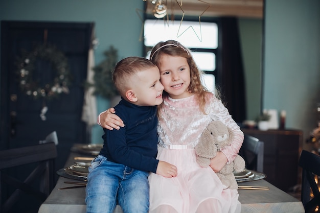 Little children in Christmas atmosphere at home