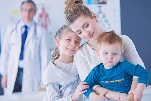 Little children with her mother at a doctor on consultation