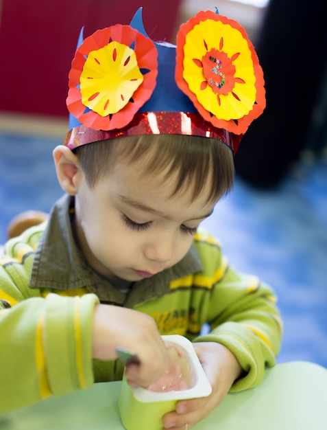 Little cute boy having birthday party at kindergarden