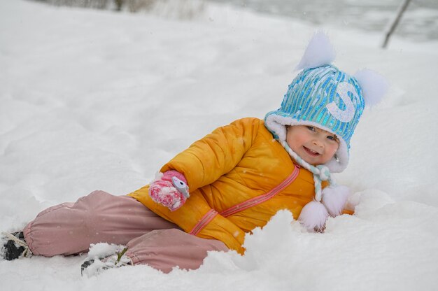 little cute girl playing in snow