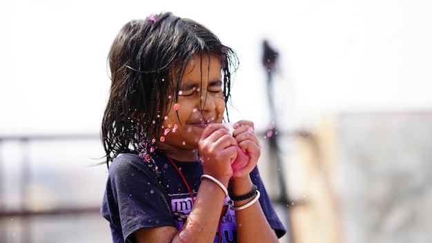 A little cute girl playing with water image