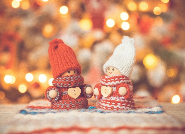 Little cute gnomes at christmas tree background