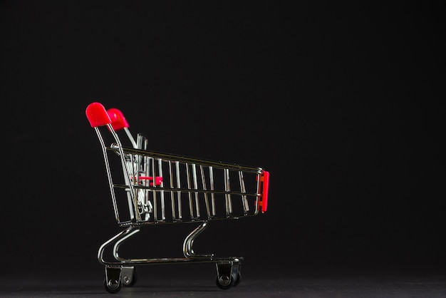 Little empty shopping trolley