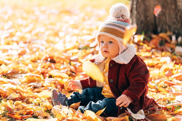 Little fashionable and stylish child autumn park