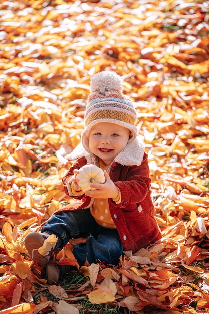 Little fashionable and stylish child autumn park