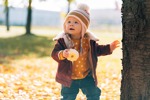 Little fashionable and stylish child autumn park