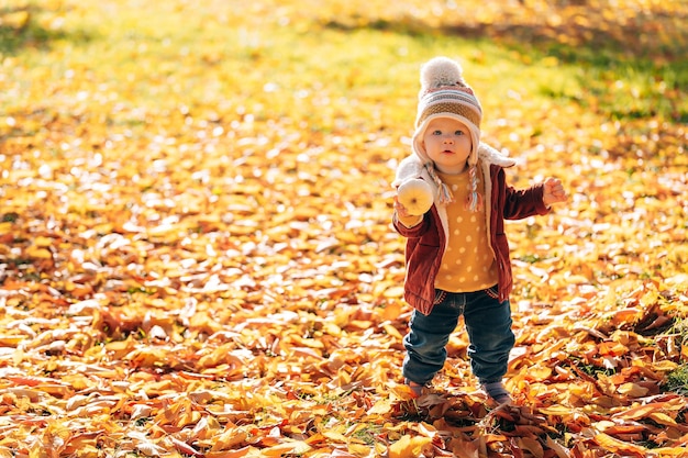 Little fashionable and stylish child autumn park