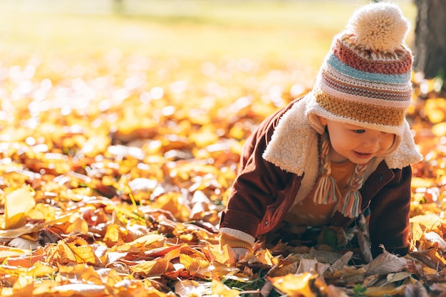 Little fashionable and stylish child autumn park