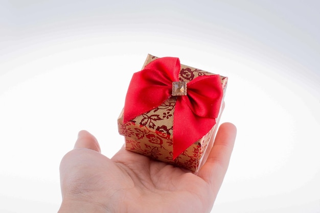 Little giftbox with a red ribbon