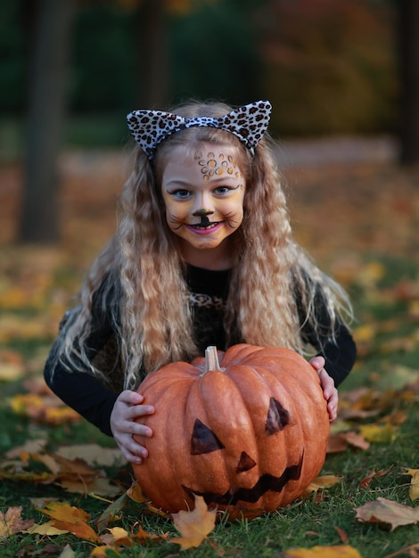 Little girl celebrates Halloween in the park