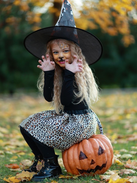 Little girl celebrates Halloween in the park