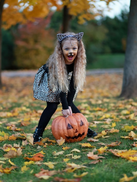 Little girl celebrates Halloween in the park