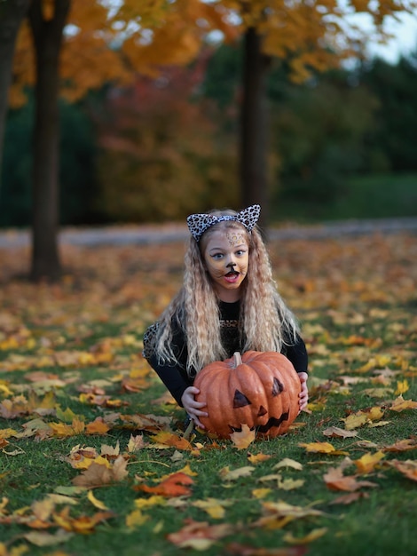 Little girl celebrates Halloween in the park