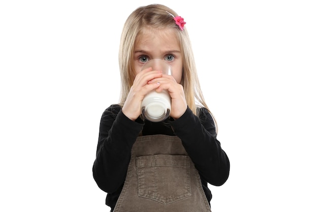 Little girl child drinking milk kid glass healthy eating isolated on white