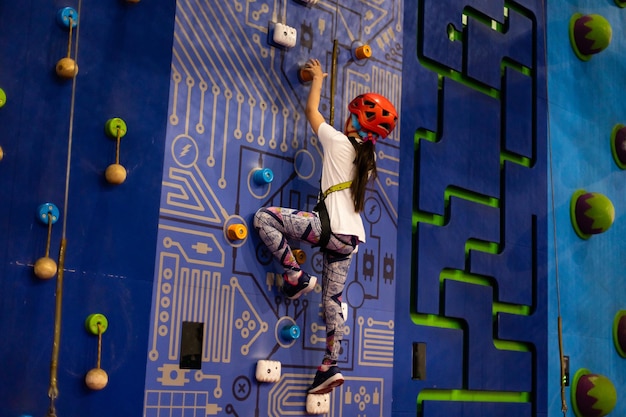 Little Girl Climbing Rock Wall.