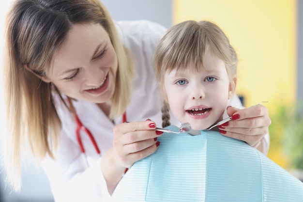 Little girl at the dentist office. Treatment of milk teeth in children