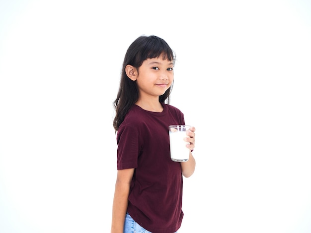 Little girl drinking milk on white background