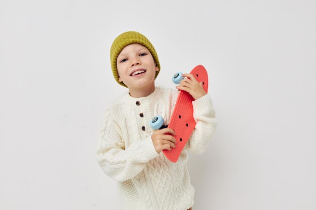 Little girl in hats with a skateboard in their hands childhood unaltered