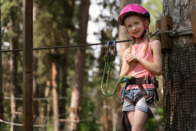 Little girl having fun at an adventure park