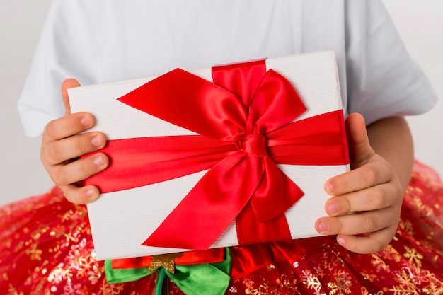 Little girl holding a wrapped present