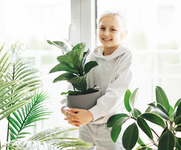 Little girl and houseplants