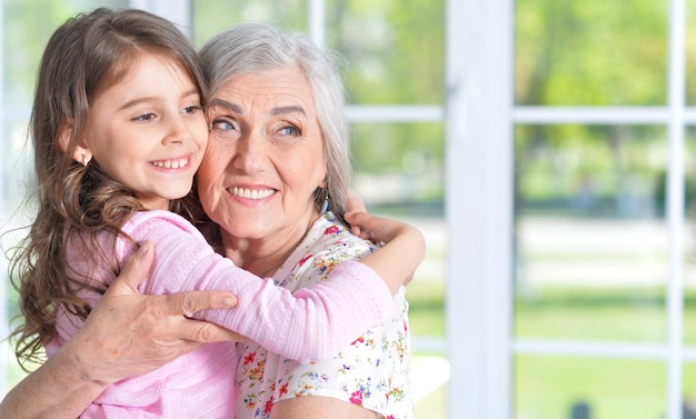 Little girl hugging grandmother