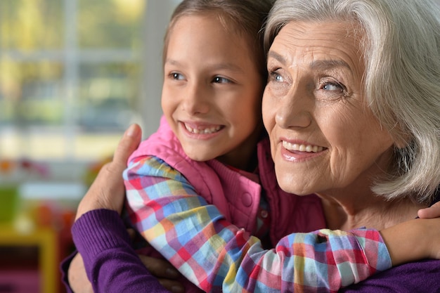 Little girl hugging her grandmother