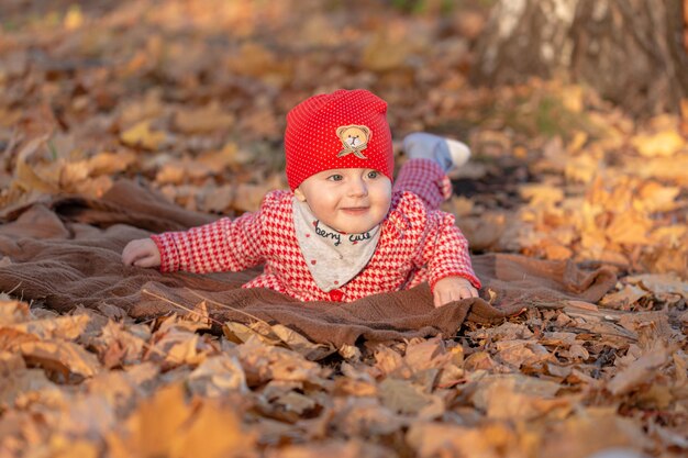 The little girl is smiling cheerfully lying on a soft Mat