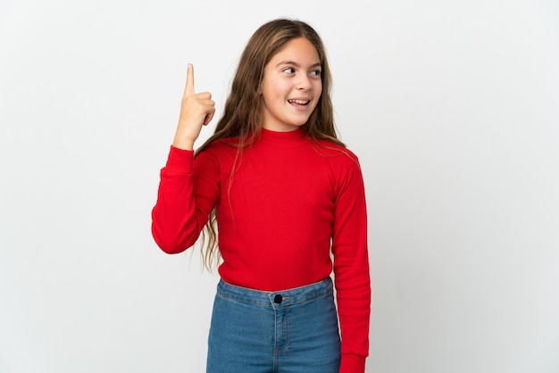 Little girl over isolated white background intending to realizes the solution while lifting a finger up