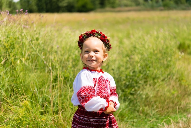 little girl in national Ukrainian clothes - vyshyvanka. Ukraine, child in nature