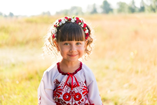 little girl in national Ukrainian clothes - vyshyvanka. Ukraine, child in nature